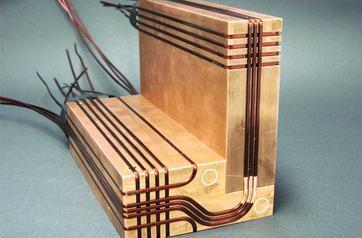 Mesoscopic atom chip on a block of copper